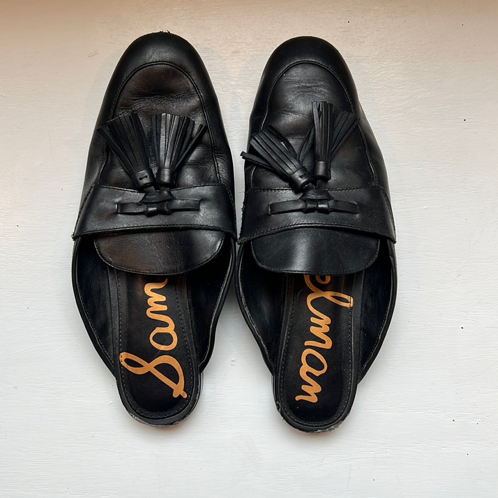 Heavily worn black Sam Eldeman Black Leather loafer mules with tassels